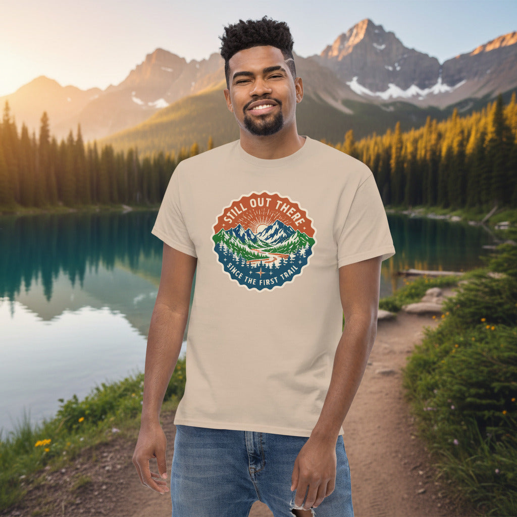 Tan T-shirt with a circular trail badge graphic centered on the chest.
