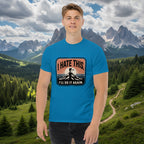 Bright blue hiking T-shirt with centered chest logo patch and mountain silhouette.