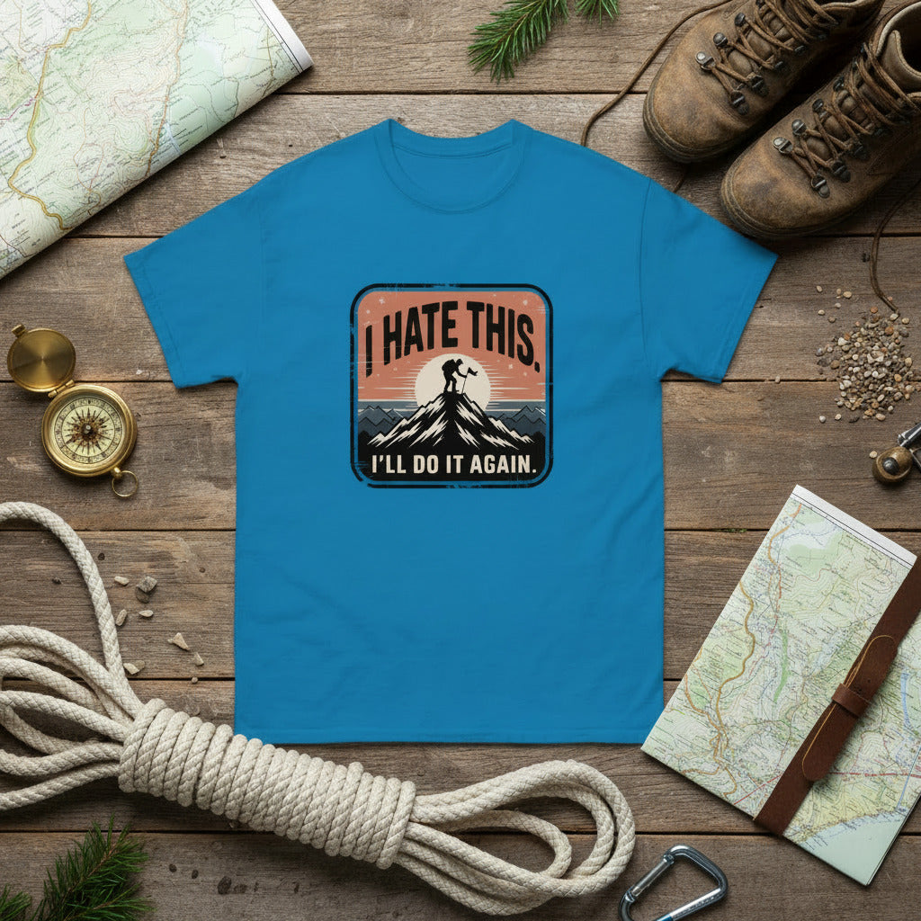 Blue hiking T-shirt with chest logo graphic and text inside patch.