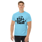 Sky blue hiking T-shirt with black "Still Out There" logo graphic on the chest