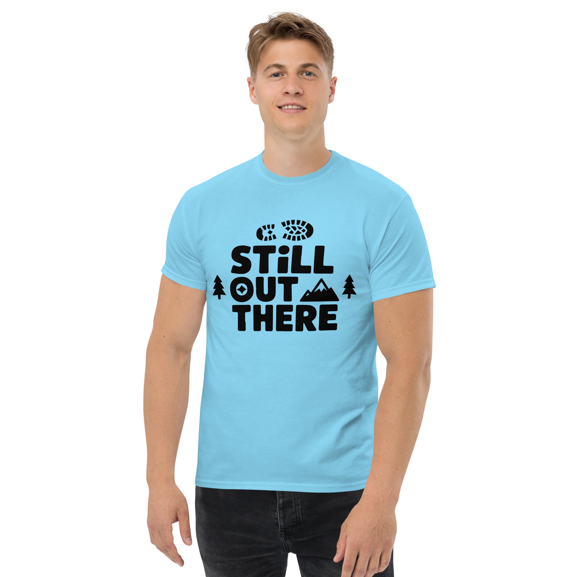 Sky blue hiking T-shirt with black "Still Out There" logo graphic on the chest