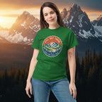 Green T-shirt with a circular trail badge graphic printed on the chest.