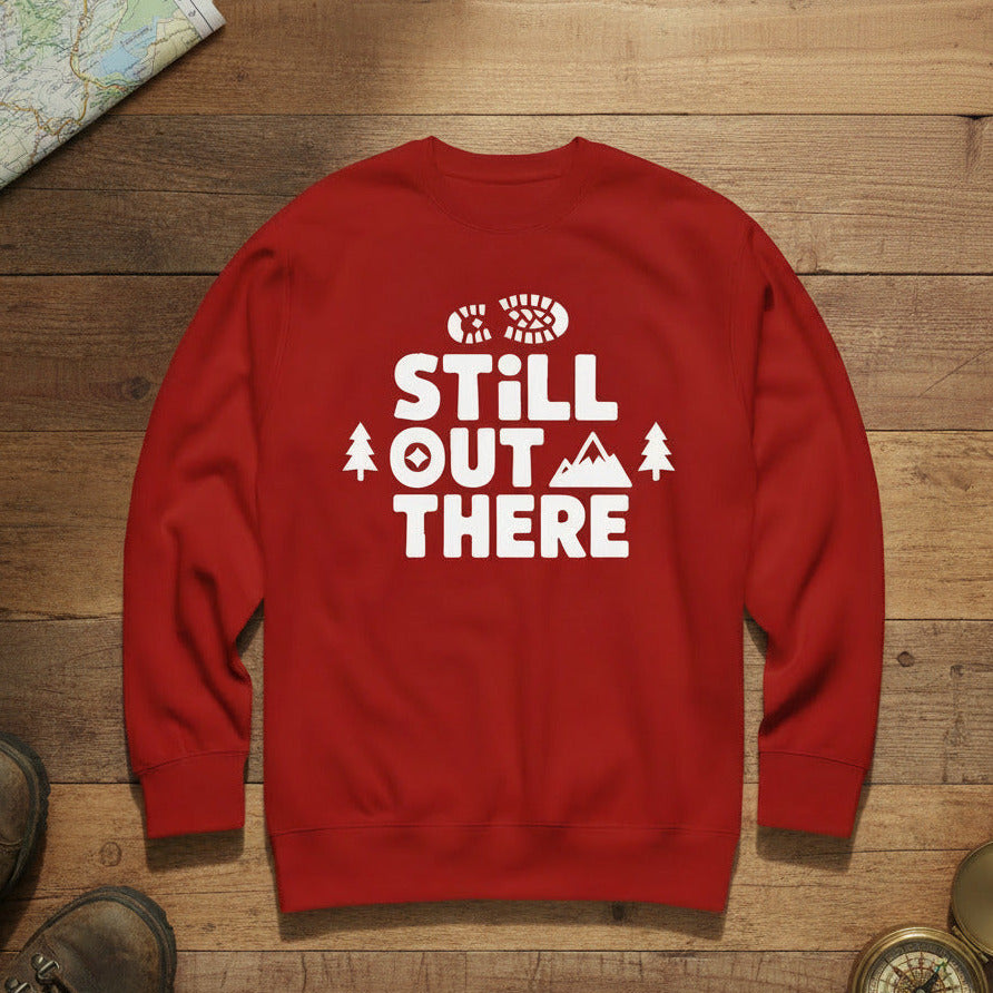 Hiking premium sweatshirt, red with white "STILL OUT THERE" logo and tree graphic