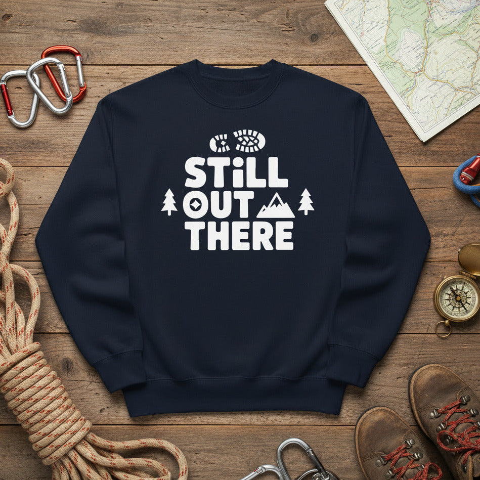 Hiking premium sweatshirt, navy with white "STILL OUT THERE" logo and tree graphic