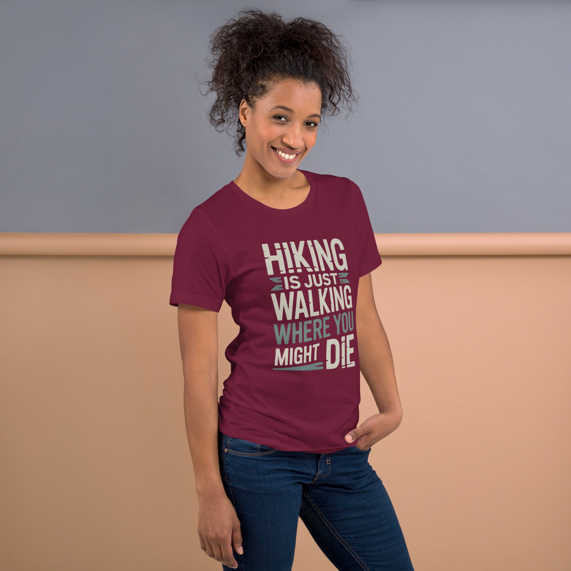 Maroon funny hiking t-shirt with large 'Hiking is just walking...' chest graphic