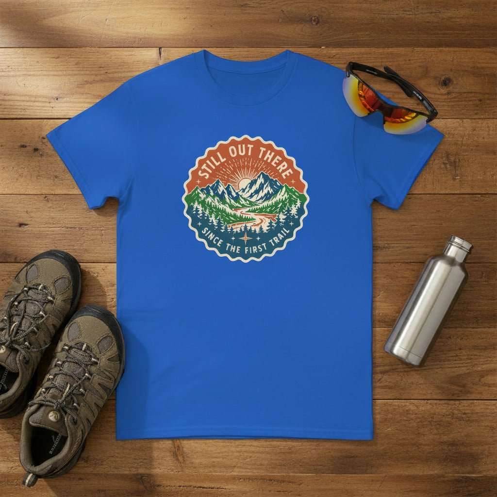 Blue hiking t-shirt with round vintage trail badge graphic on the chest