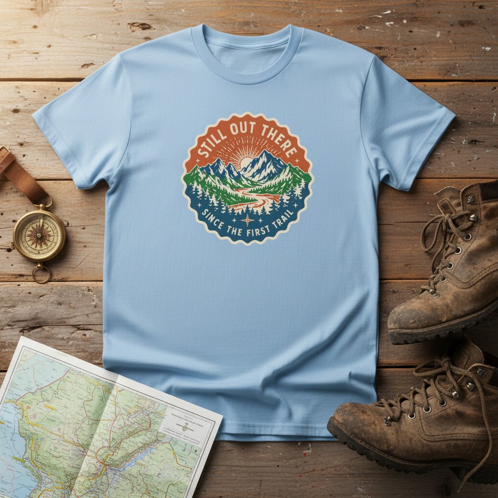 Light blue hiking t-shirt with round vintage trail badge graphic on the chest