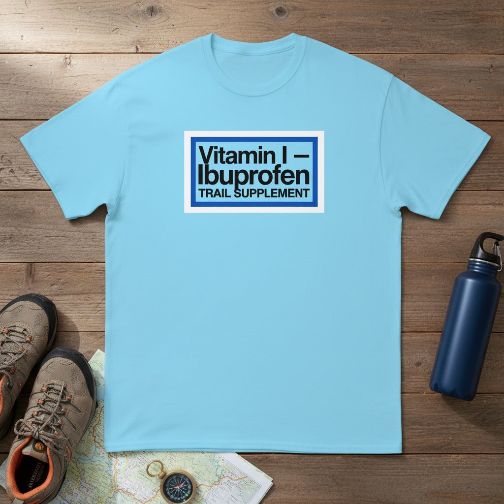 Light blue T-shirt with Vitamin I—Ibuprofen Trail Supplement logo on front.
